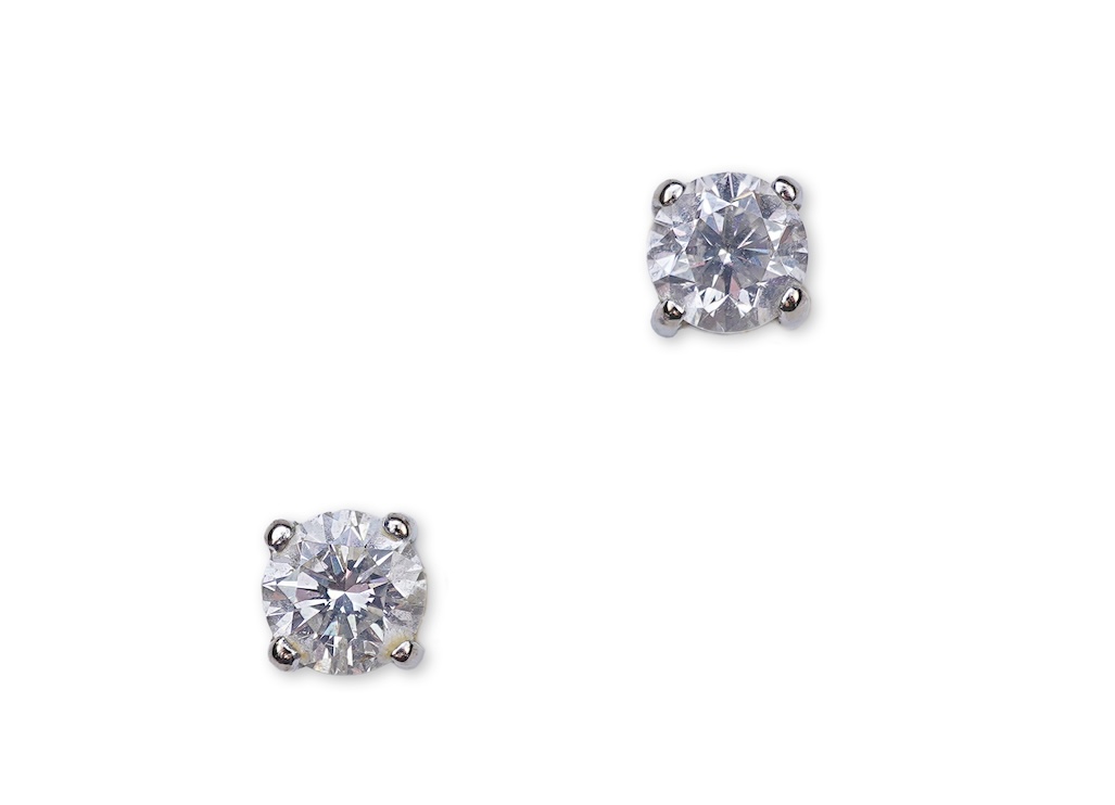 A pair of diamond stud earrings